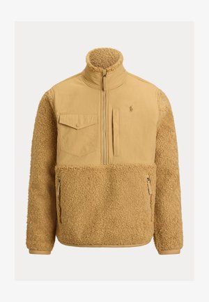 Beige fleece jacket with a smooth fabric upper, zip front, high collar, chest pocket, and two side zip pockets. Texture is soft and fluffy.