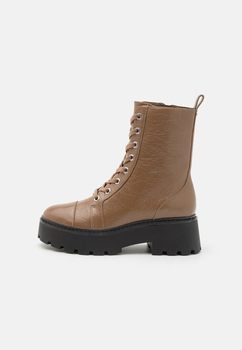 Brown faux leather ankle boots with a chunky black sole, round toe, front lacing, and a pull tab at the back. Textured surface detail.