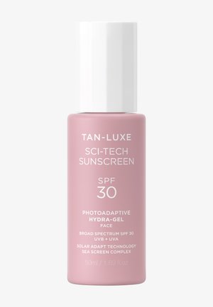 Krem przeciwsłoneczny Tan-Luxe Sci-Tech w różowej butelce z białą nakrętką, SPF 30, fotoadaptacyjny żel nawilżający do twarzy, szerokie spektrum ochrony UVB + UVA, 50 ml.