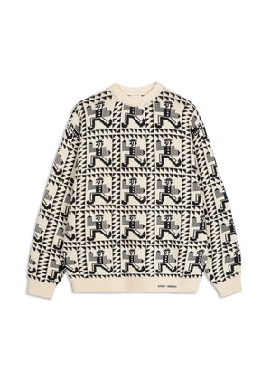 Knit sweater in beige with a repeating black geometric and figure pattern, ribbed crew neck, and long sleeves. Features text detail at the hem.