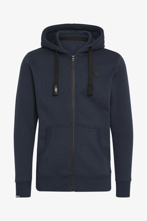 Donkerblauwe zip-up hoodie, gemaakt van zacht materiaal; met een capuchon, trekkoord, twee voorzakken en geribbelde manchetten.