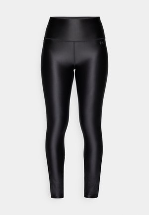 Sorte højtaljede leggings lavet af glat, strækbart materiale. Har en sidelomme og et subtilt logo på taljebåndet.