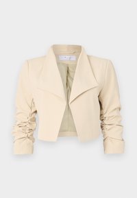 Lys beige kort jakke med en bred krave, rynkede lange ærmer og et åbent frontdesign. Glat stof med en blød tekstur.