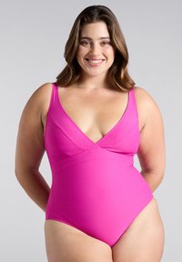 Bañador de una sola pieza en rosa brillante, con un diseño de escote en V, tirantes ajustables y un patrón texturizado de zigzag en toda la prenda.