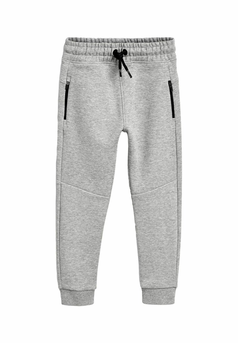 Pantalon de jogging gris clair avec taille élastique, cordon noir, poches latérales zippées et chevilles resserrées, posé à plat sur fond blanc.