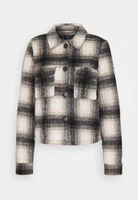 Veste en mélange de laine à carreaux en noir, blanc et gris, avec un col, des poches avant et des fermetures à boutons.
