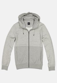 Sweat à capuche gris zippé avec capuche à cordon, section supérieure texturée et panneau inférieur lisse. Comprend deux poches latérales et des poignets côtelés.