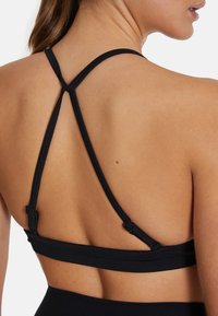 SQUATPROOF DRILL - Sportski grudnjak s blagom potporom - black