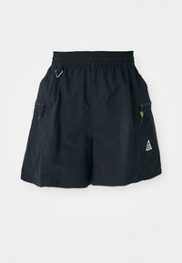Black shorts made of lightweight fabric, featuring an elastic waistband, side pockets with zippers, and a triangle logo on the hem.