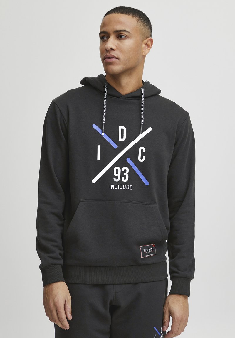 Black hoodie featuring a kangaroo pocket, drawstring hood, and a large graphic design with blue and white accents. Soft fabric texture.