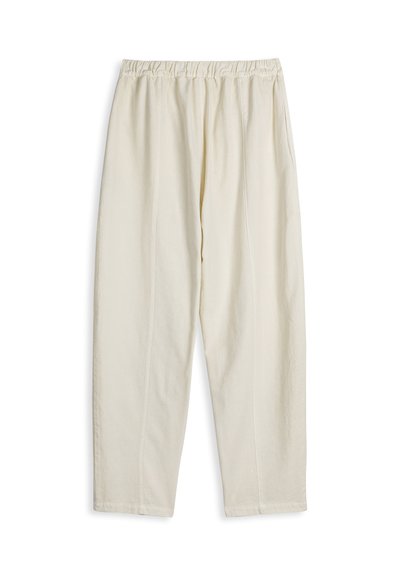 Pantalon ample de couleur crème avec une taille élastique et des poches latérales, étalé à plat sur un fond blanc.