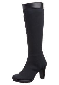 Botas negras hasta la rodilla hechas de un tejido suave con un puño de cuero negro brillante. Cuentan con una punta redondeada y un tacón alto en bloque.