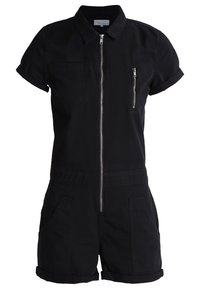 Combinaison noire à manches courtes en coton, dotée d'une fermeture éclair à l'avant, d'une poche poitrine zippée et de deux poches avant.