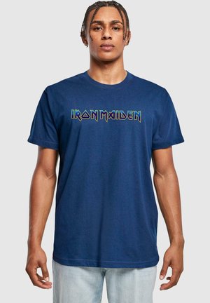 Navy blue cotton t-shirt featuring the text "IRON MAIDEN" in bold multicolored lettering across the chest. Short sleeves and crew neck design.