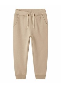 Beige Jogginghosen mit elastischem Bund, Kordelzug, Seitentaschen und Rippbündchen an den Knöcheln.