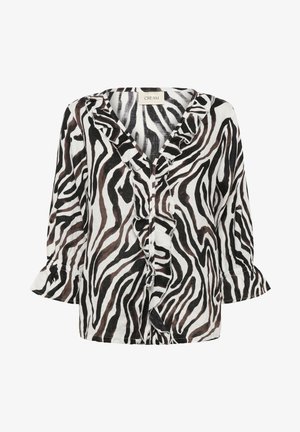 Blouse imprimée zébrée noir et blanc avec col en V à volants et manches évasées 3/4, tissu léger, et étiquette de marque "CREAM" à l'intérieur du col.