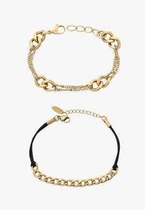 Dwie bransoletki: jedna z ogniw łańcucha złotego z wieloma małymi łańcuchami, druga z czarnego sznurka ze złotym łańcuchem i zapięciem, obie z przedłużkami.