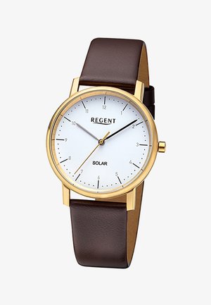 Montre-bracelet analogique avec boîtier en or, cadran blanc, aiguilles noires et dorées, index horaires minimalistes, et bracelet en cuir marron, affichant 10:09:35.