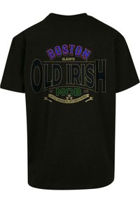 Black cotton t-shirt featuring bold multicolored text: "BOSTON," "SLÁINTE," "OLD IRISH," and "MOB" with decorative accents and a green banner.