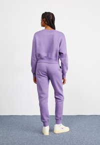 Nike Sportswear PANT - Treniņtērpa apakšdaļas - daybreak/black