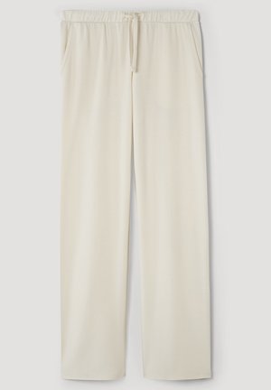 Pantaloni lounge in tessuto morbido color crema, con cintura elastica, cordino regolabile e tasche laterali; design a gamba dritta.