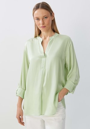 Light green blouse with a mandarin collar, buttoned cuffs, and a straight cut. Made from smooth, silky fabric, featuring a front placket.
