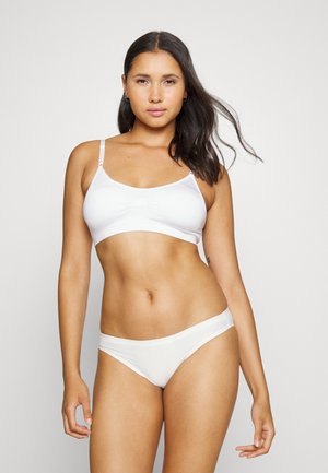 White bikini set featuring a simple, soft cup bralette and matching low-rise briefs, both with smooth texture and minimal design.
