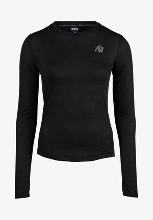 Črna dolgoročna športna majica iz teksturirane tkanine. Ima majhen sivi logo na zgornjem levem prsnem delu in okroglo ovratnico.