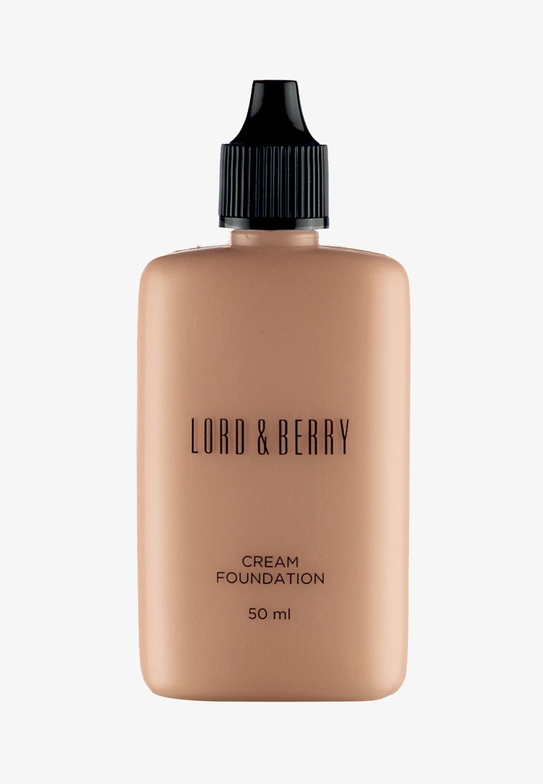 Fondotinta cremoso in una bottiglia beige chiaro con un tappo a contagocce nero. Presenta un branding semplice in testo nero, volume di 50 ml.