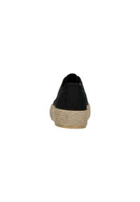 Espadrille noire en toile avec une semelle intermédiaire en jute texturé et une semelle extérieure en caoutchouc, offrant une vue arrière élégante et un détail minimaliste de couture.