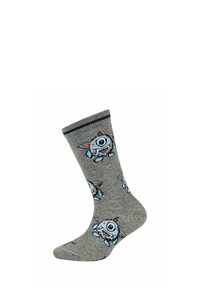 Calzino grigio con un cartone animato di un mostro blu monocolore con macchie arancioni e un piccolo corno, motivo ripetuto, bordo a coste con striscia scura.