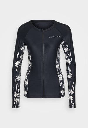 Rash guard de manga longa azul-marinho com padrão de folhas de palmeira brancas nas mangas. Apresenta um fecho na frente e tecido texturizado para conforto e durabilidade.