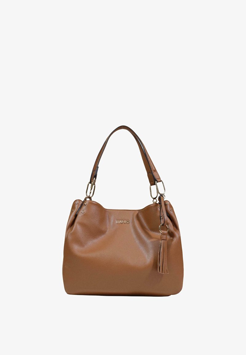 Sac à main en cuir marron avec doubles poignées, ferrures dorées, détail pompon et petit logo au centre avant.