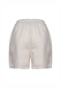 Pantaloni corti in lino di colore beige chiaro con cintura elasticizzata. Il tessuto ha una consistenza morbida e presenta cuciture lungo l'orlo.
