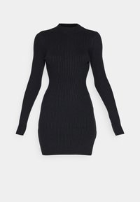 Svart ribbad långärmad klänning med hög krage, figurnära silhuett och strukturerad mönster, som visar en mjuk, elastisk tyg.