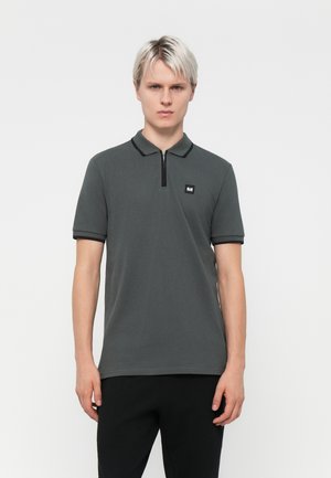 Dark gray polo shirt with a zipper collar, short sleeves, and black trim. Features a small logo patch on the left chest. Cotton material.