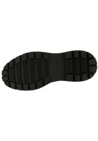 Schwarze Gummisohle mit tiefen Profilen und Rillen für besseren Halt, die einen glatten zentralen Bereich aufweist. Das Design fördert Langlebigkeit und Abriebfestigkeit.