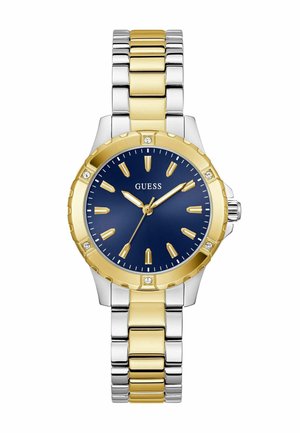Montre en métal doré et argenté avec un cadran bleu, des accents dorés et des marqueurs ressemblant à des diamants. Elle possède un boîtier rond et un bracelet à maillons.