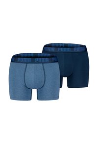 Zwei Paar Boxershorts in Blautönen; eines meliert und eines in einfarbigem Marineblau, beide mit elastischem Bund und "PUMA"-Logo.