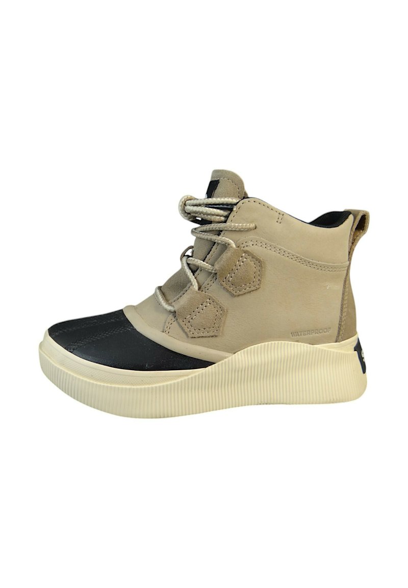 Beige waterproof high-top shoes with a black rubber toe cap, textured ridged sole, and gray laces. Features angular accents on sides.