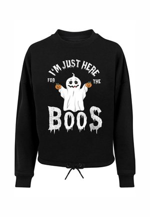 Schwarzer Kapuzenpullover mit Kordelzugsaum. Mit einem Grafikdesign von einem Geist, der Kürbisse hält, und dem Text "ICH BIN NUR FÜR DIE GEISTER DA" in Weiß.