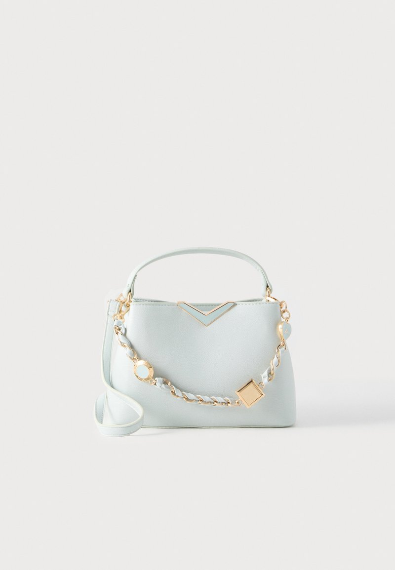 Light blue synthetic leather handbag with a structured shape, gold-tone hardware, a top handle, and a decorative chain strap featuring geometric accents.