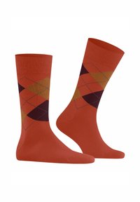 Oranje katoenen sokken met een diamantpatroon in dunkelpaars, bruin en goud, met een geribbelde boord en een gladde textuur.