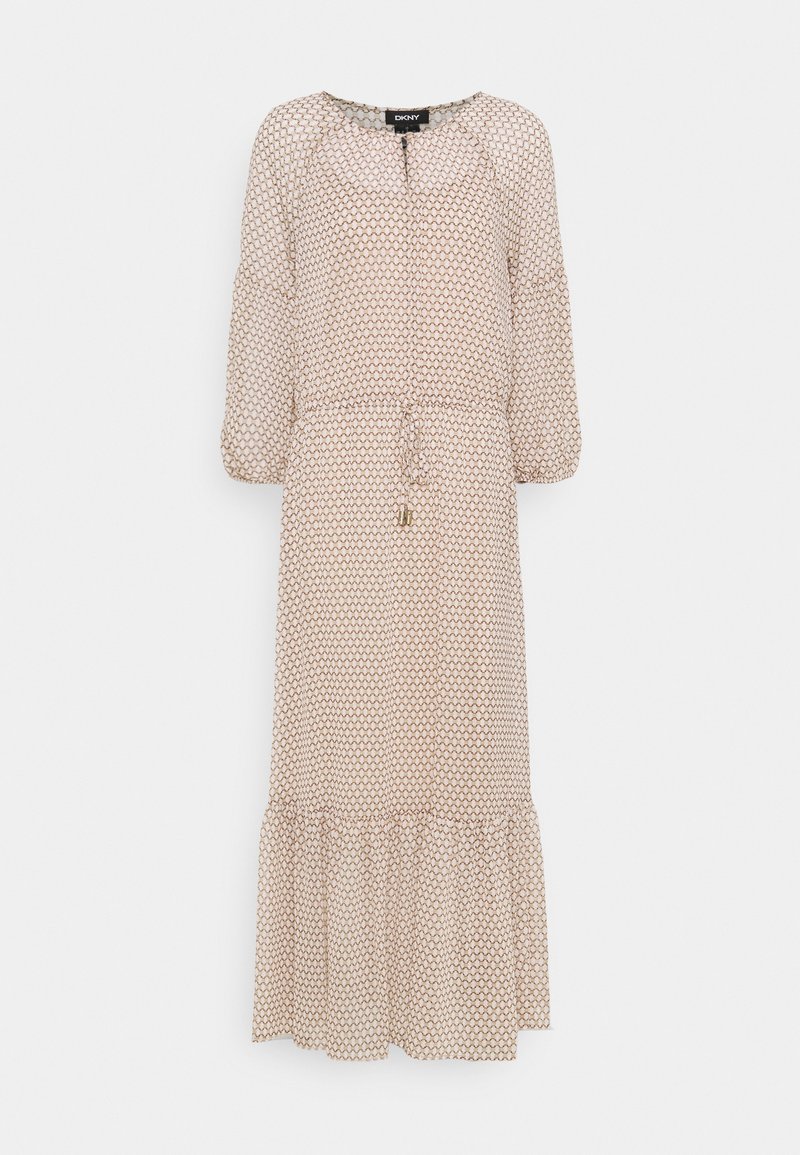 Lång klänning i beige med ett vågmönster i brunt. Har rund halsringning, gathered ärmar och en flerlagerskjol med dragsko-detalj.