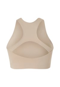 Beige sportsbh med rundudskæring, brede stropper og et glat, sømløst design. Har udskæringer på ryggen for åndbarhed.