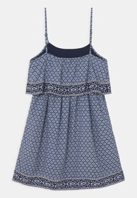 Sundress with thin straps, navy blue top, and patterned skirt featuring a diamond design in shades of blue, with a decorative border at the hem.