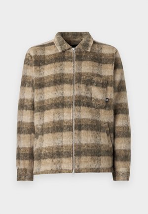 Checkered, zip-up jacket in tan and dark brown, featuring a soft textured fabric, collar, and a front pocket with a small logo detail.