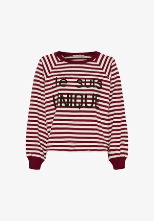 Langærmet skjorte med horisontale røde og hvide striber samt sort tekst "je suis UNIQUE" på fronten, ribbede manchetter og krave.