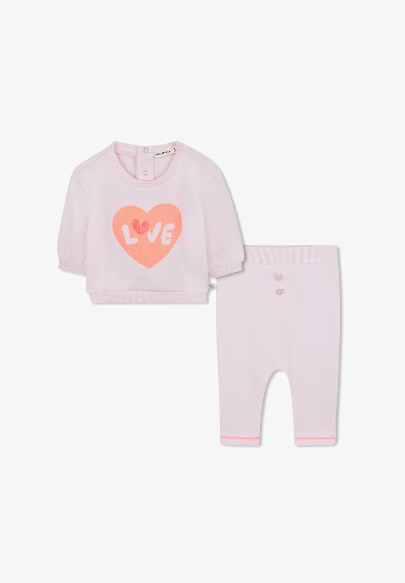 Ensemble en coton rose composé d'un haut à manches courtes avec un motif en forme de cœur et d'un legging assorti avec des boutons en forme de cœur et un ourlet festonné.