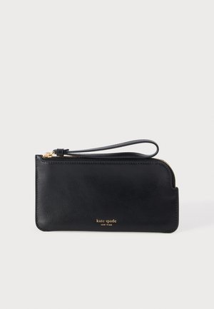 Portefeuille bracelet en cuir noir avec fermeture éclair dorée et petit logo doré "kate spade new york" à l'avant.